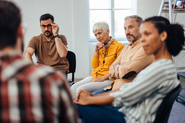 image of 5 people in a group talking