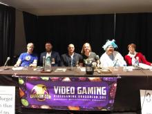 Photo of Paul Baker (seated third from left) on the Dystopian future tech and gaming panel at Dragon Con 2017